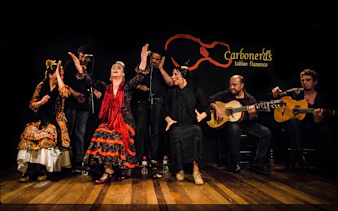 Flamenco dancers and guitarists performing at Tablao LAS CARBONERAS in Madrid.