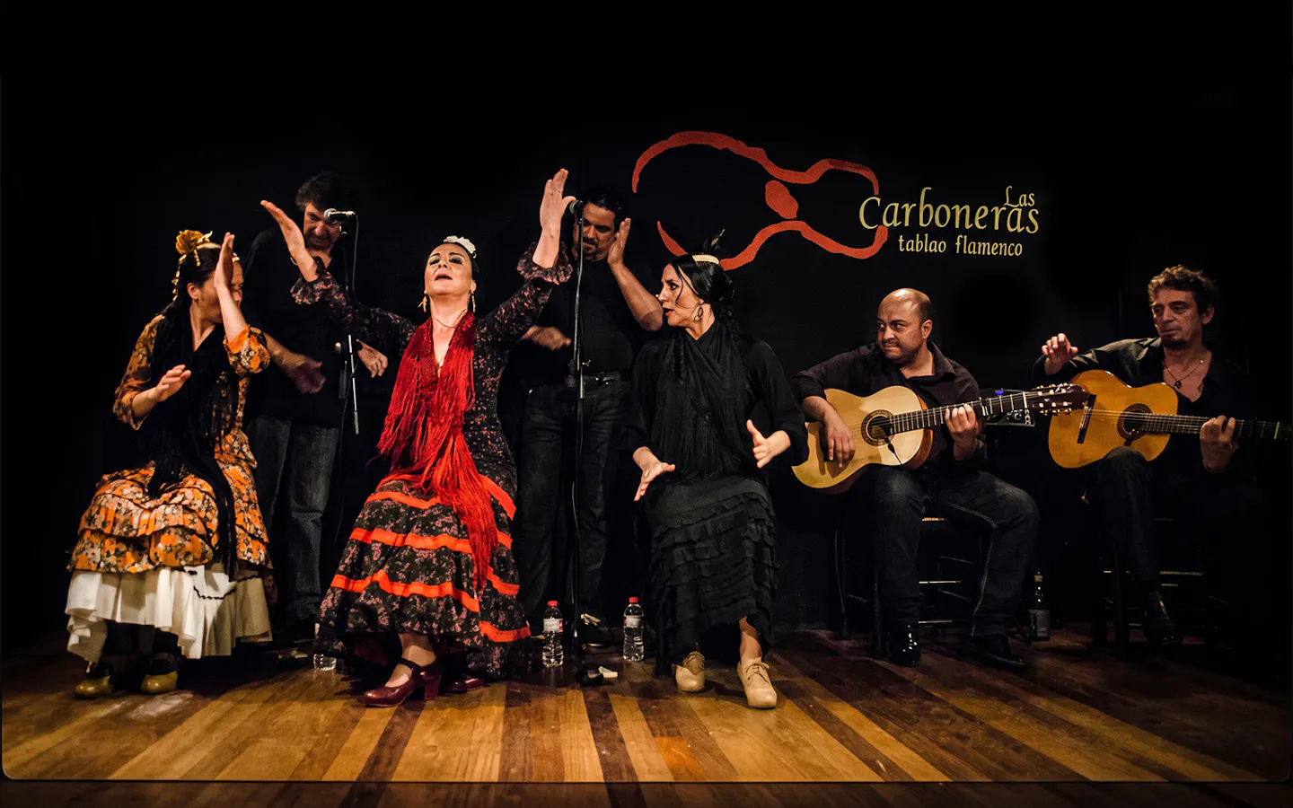 Flamenco dancers and guitarists performing at Tablao LAS CARBONERAS in Madrid.