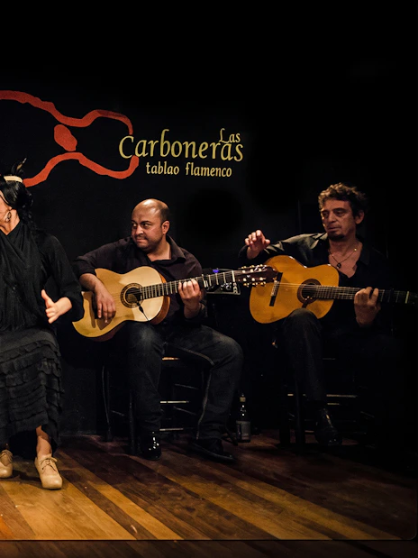 Flamenco dancers and guitarists performing at Tablao LAS CARBONERAS in Madrid.