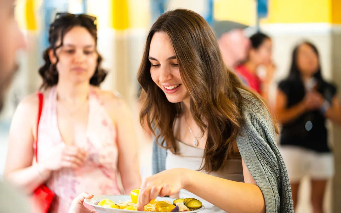 Tour participants sampling local dishes on a Budapest food tour.