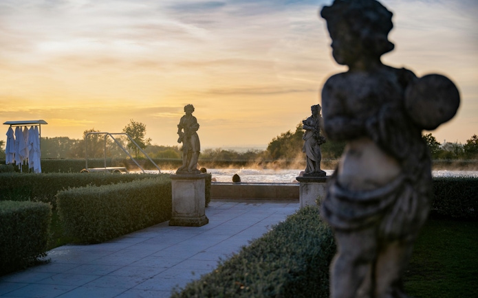 Statues and pool at sunset, QC Terme Garda exteriors.