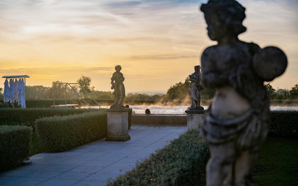 Statues and pool at sunset, QC Terme Garda exteriors.