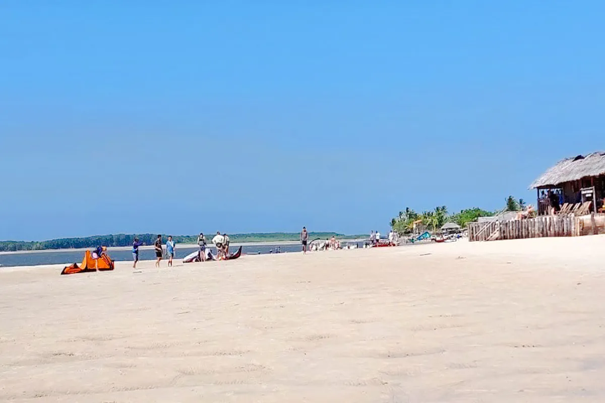 Beach scene with people and kites at Canto do Atins, part of the 4x4 tour from Sao Paulo.