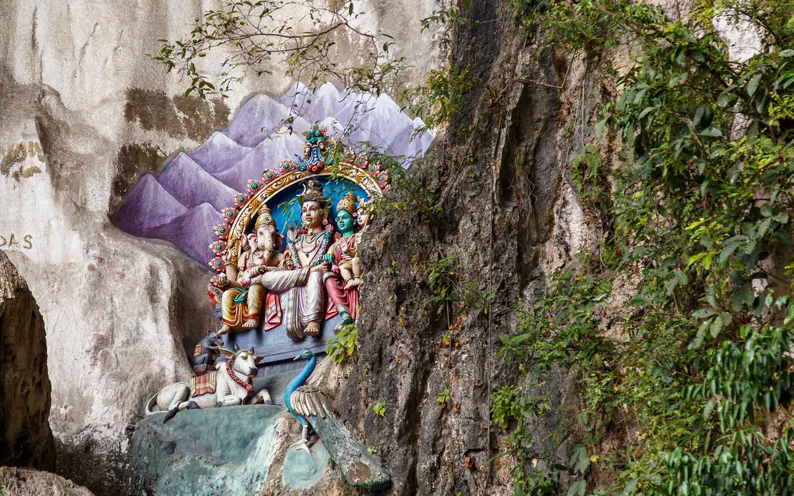 Colorful mural on a stone in Batu Cave in Malaysia, Hinduism temple