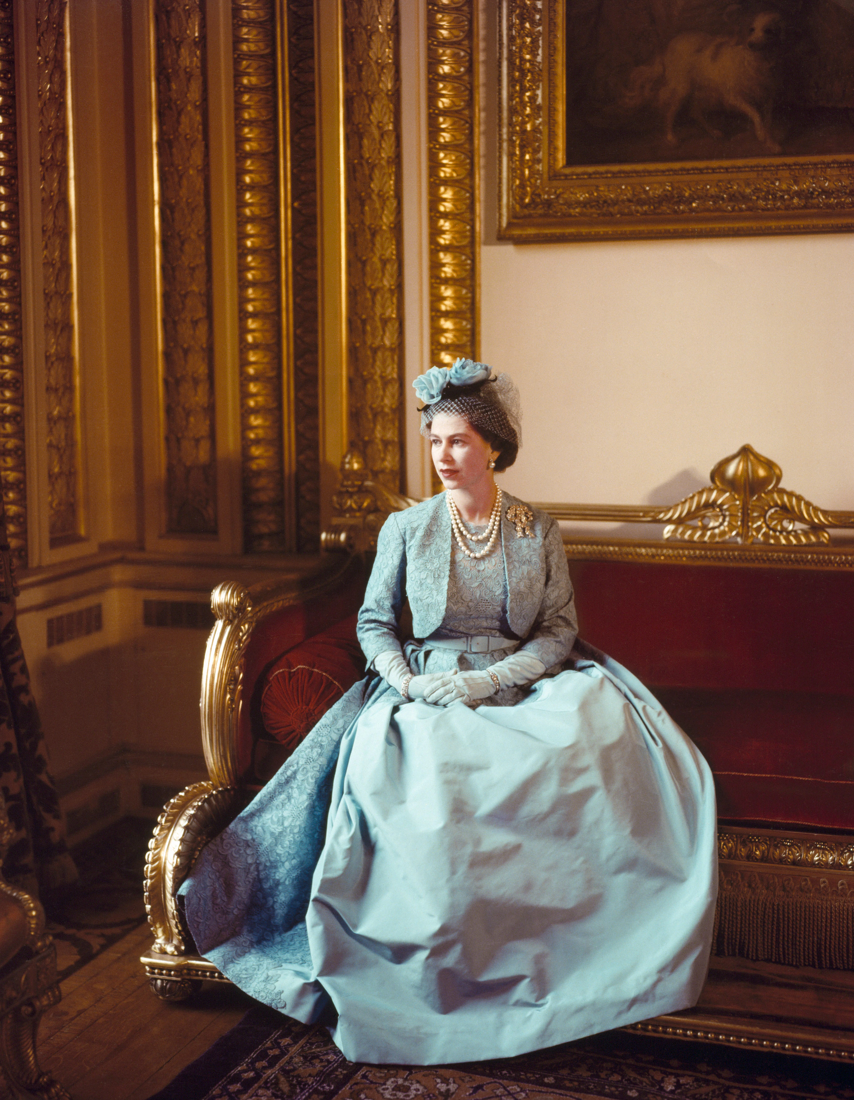 Royal figure in formal attire seated in ornate room, 1960, Victoria and Albert Museum, London.