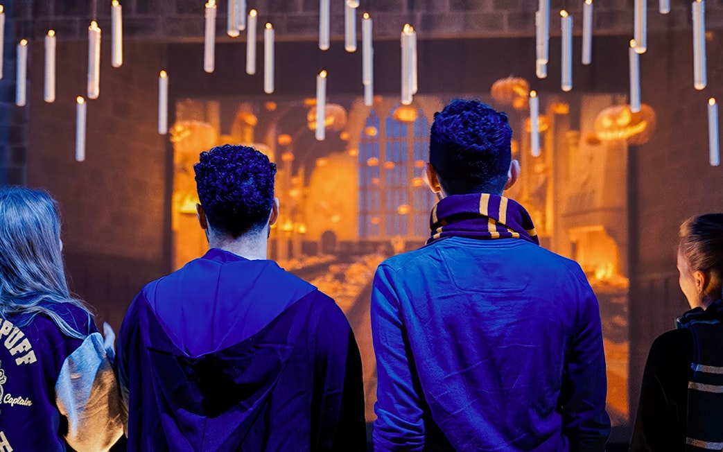 Friends exploring the Great Hall set at Harry Potter Studio Tour.