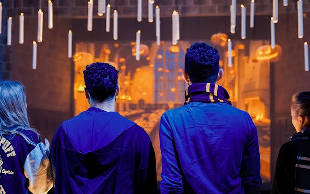 Friends exploring the Great Hall set at Harry Potter Studio Tour.