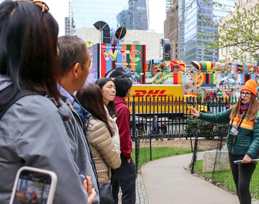Visitors on a Ground Zero guided tour at the 9/11 Memorial, New York City.