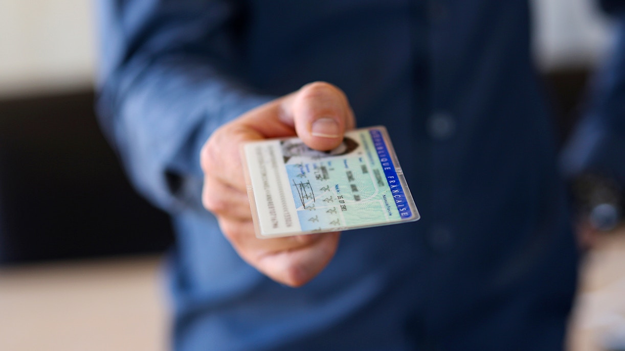 Man presenting his identity card