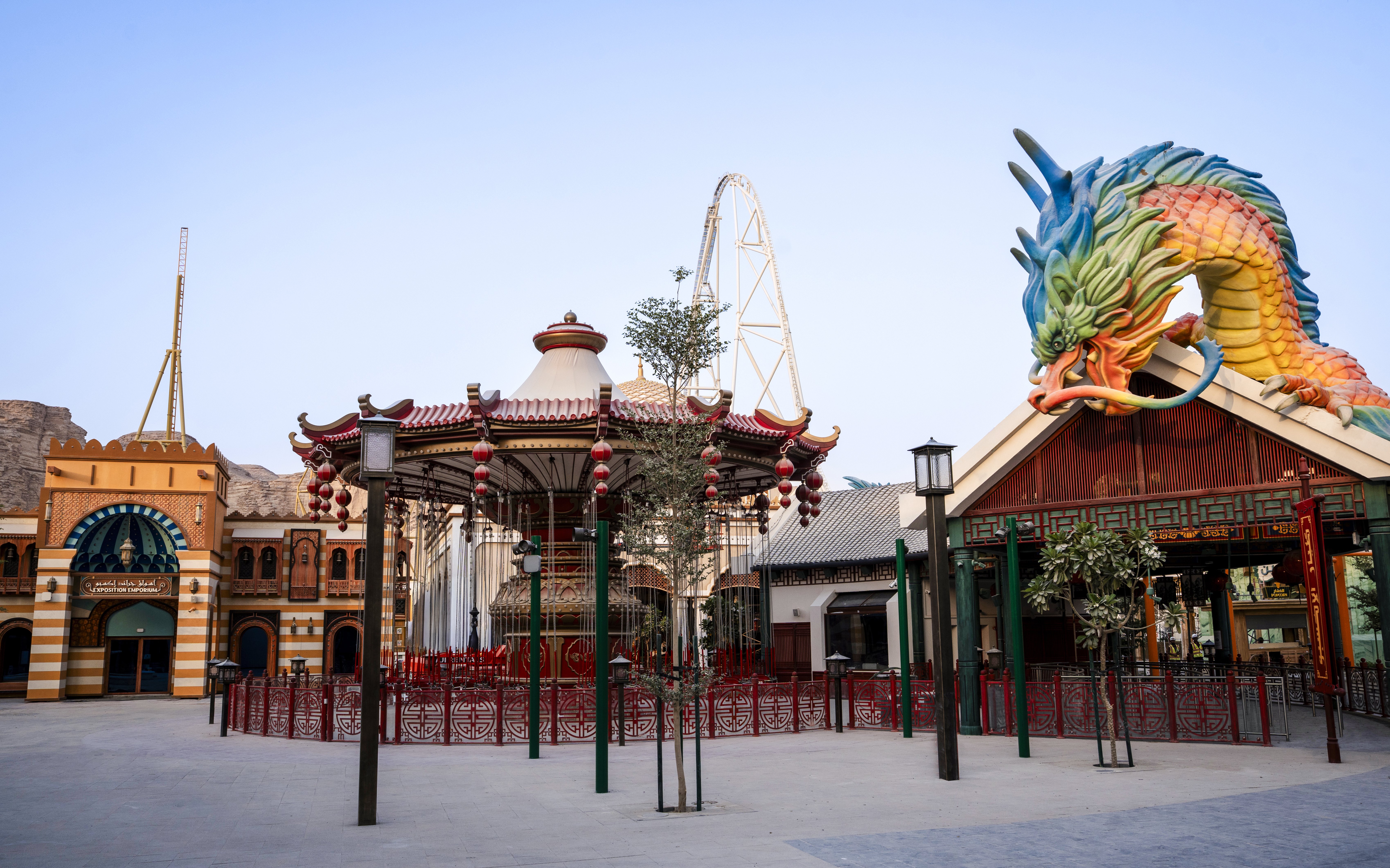 Carousel and dragon sculpture at Six Flags Qiddiya City Grand Exposition.
