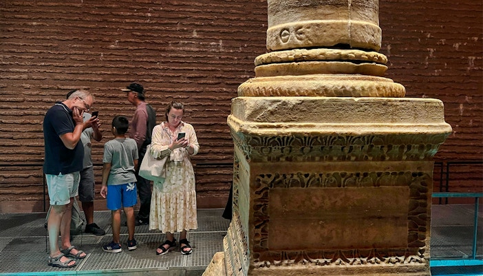 Visitors observing ancient columns at Basilica Cistern, Istanbul.