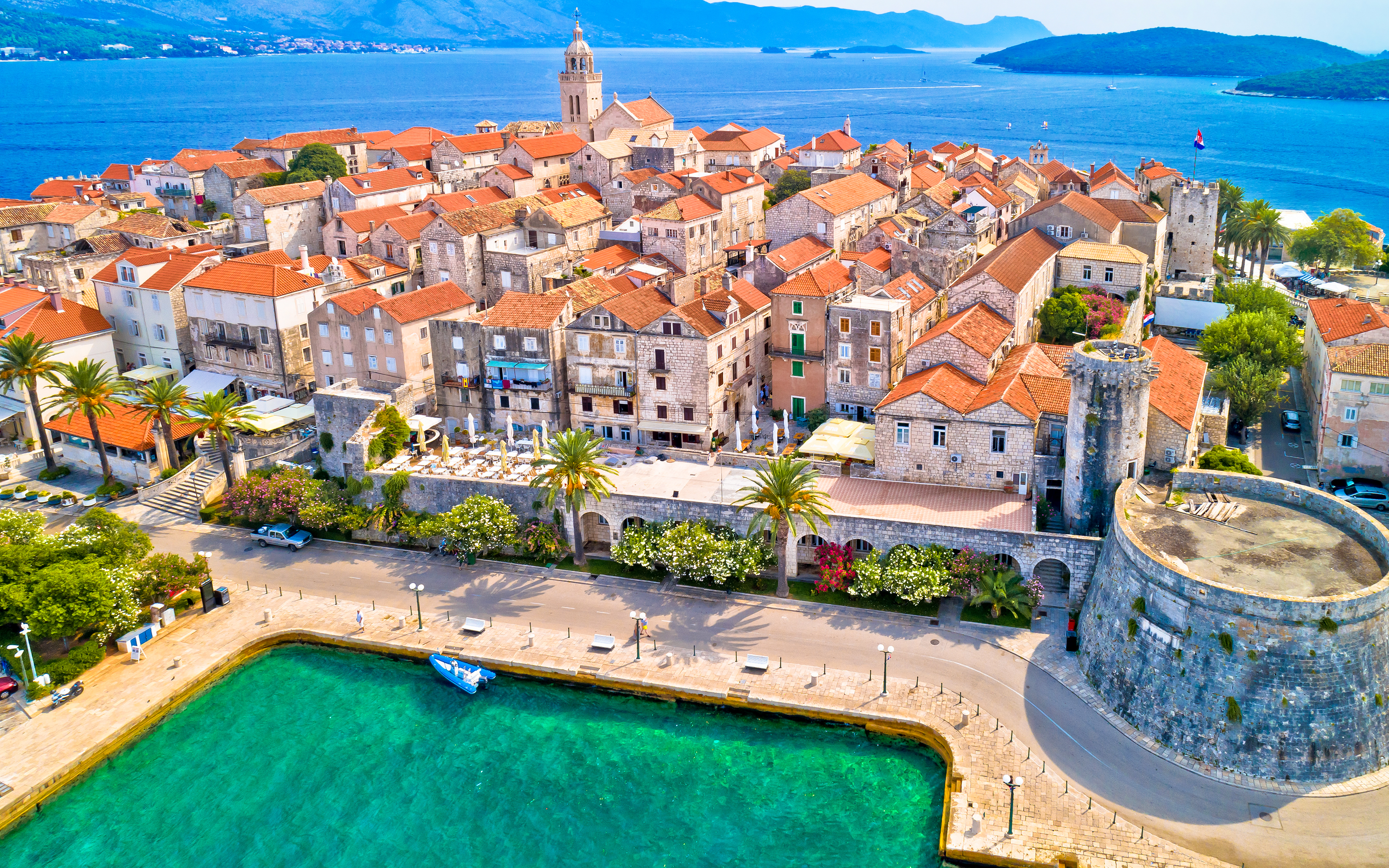 Aerial view of historic Korcula town with stone buildings and Adriatic Sea, Croatia.