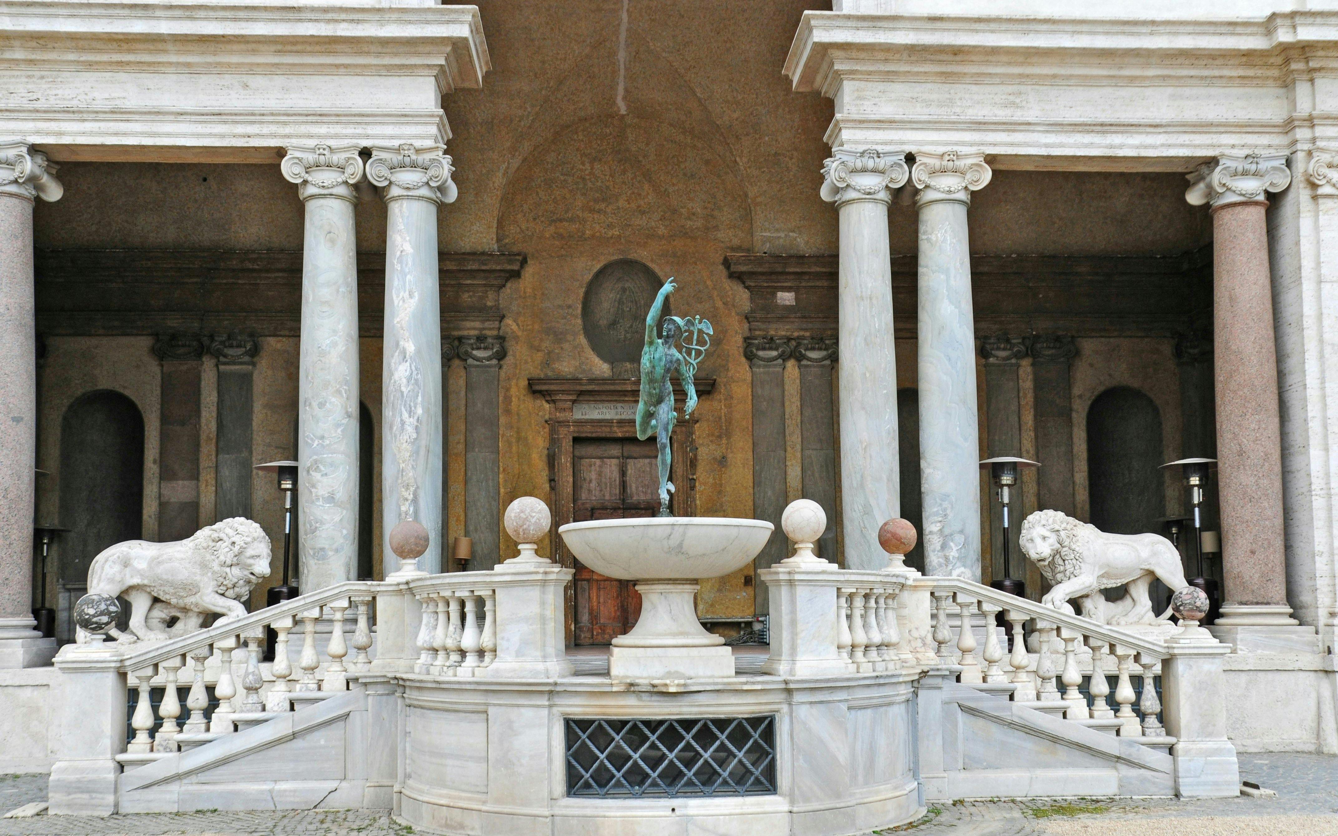 Villa Medici entrance with statues and columns in Rome, Italy.