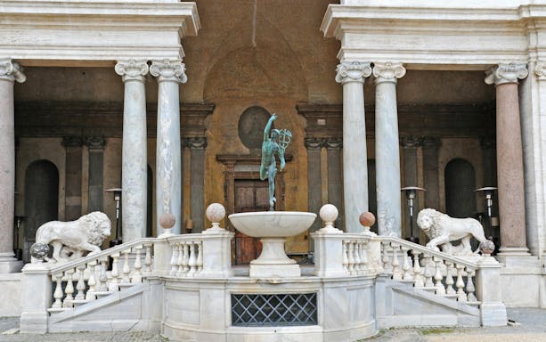 Villa Medici entrance with statues and columns in Rome, Italy.