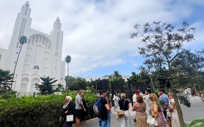 Tour group outside Casablanca's Sacré-Cœur Cathedral.