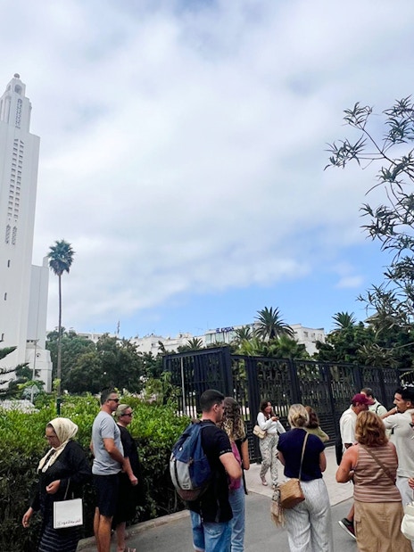 Tour group outside Casablanca's Sacré-Cœur Cathedral.