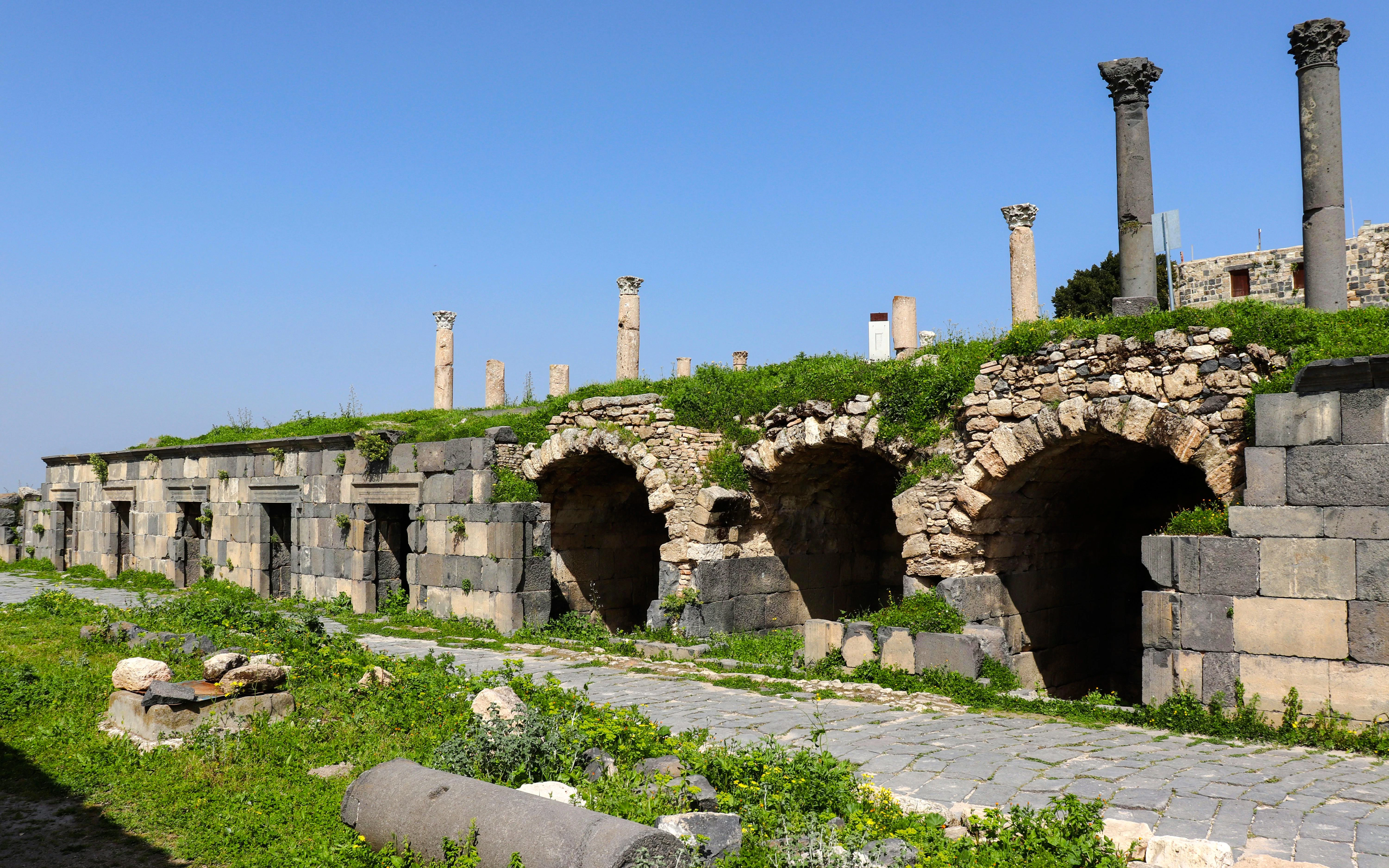 Ancient Roman ruins with stone arches and columns in Umm Qais, Irbid, Jordan.