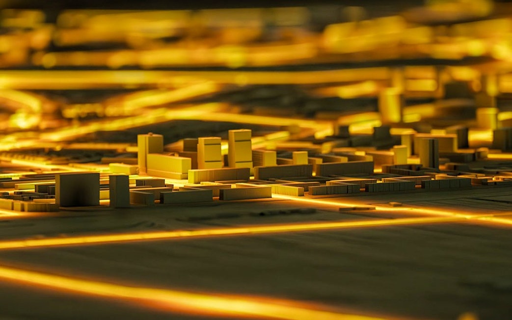 Illuminated cityscape model at Amsterdam in Motion exhibit.