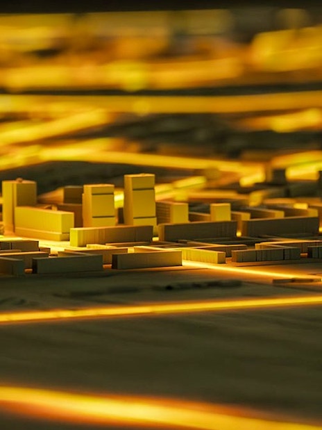 Illuminated cityscape model at Amsterdam in Motion exhibit.