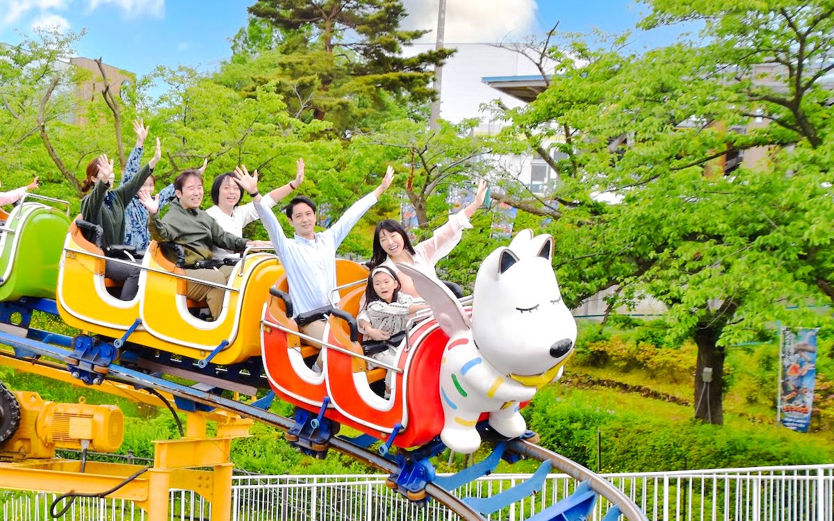 Visitors enjoying the WanWan Coaster Wandit ride at Yomiuriland near Tokyo, Japan.