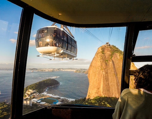 Sugar Loaf cable car overlooking Rio de Janeiro at sunset.