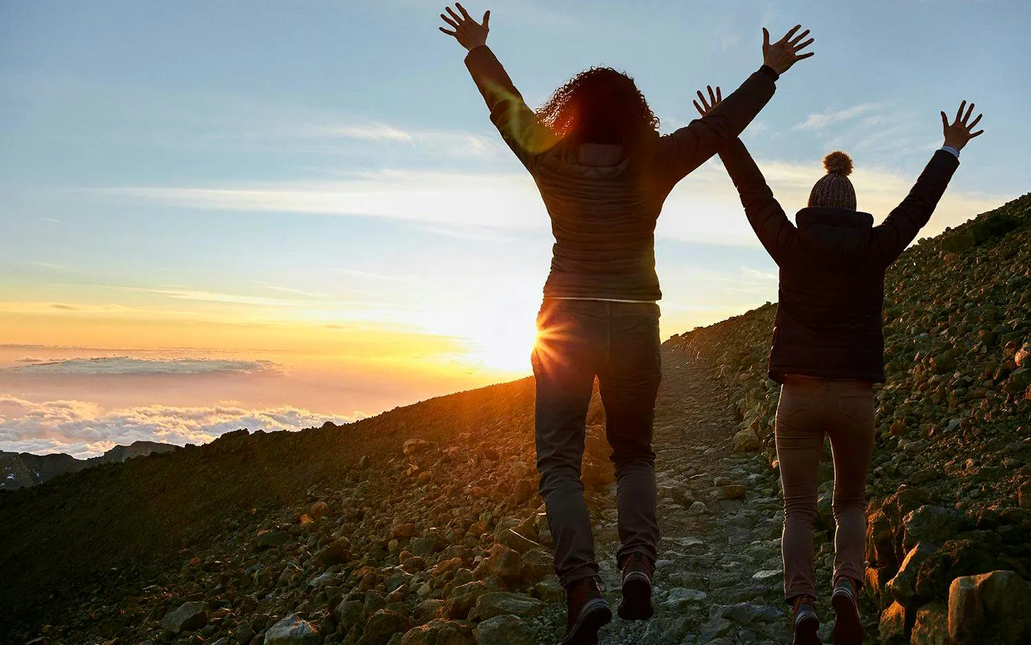 Guests celebrating sunset on Mount Teide trail, Tenerife.