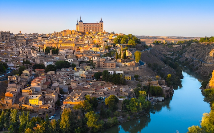 Toledo cityscape from Mirador del Valle with Alcázar and Tagus River.