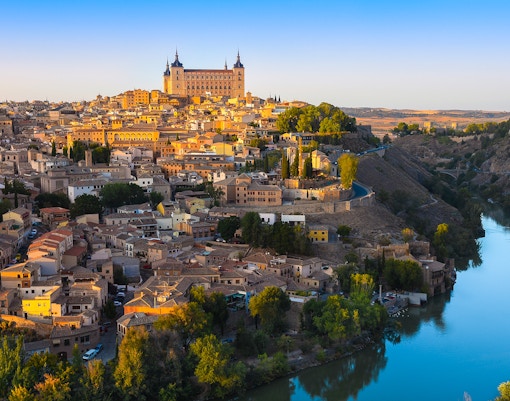 Toledo cityscape from Mirador del Valle with Alcázar and Tagus River.