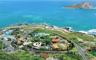 Aerial view of Sea Life Park Hawaii with ocean and island in the background.