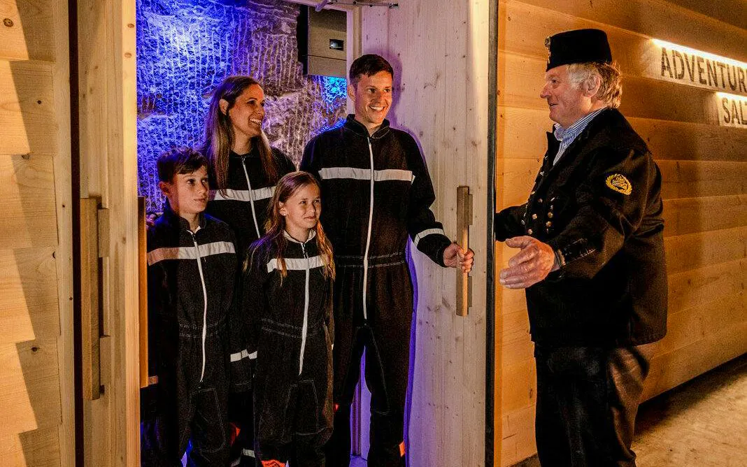 Guests entering Berchtesgaden Salt Mine with a guide.