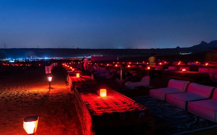 Desert camp setup for Perseids Meteor Shower viewing with red lanterns and seating.