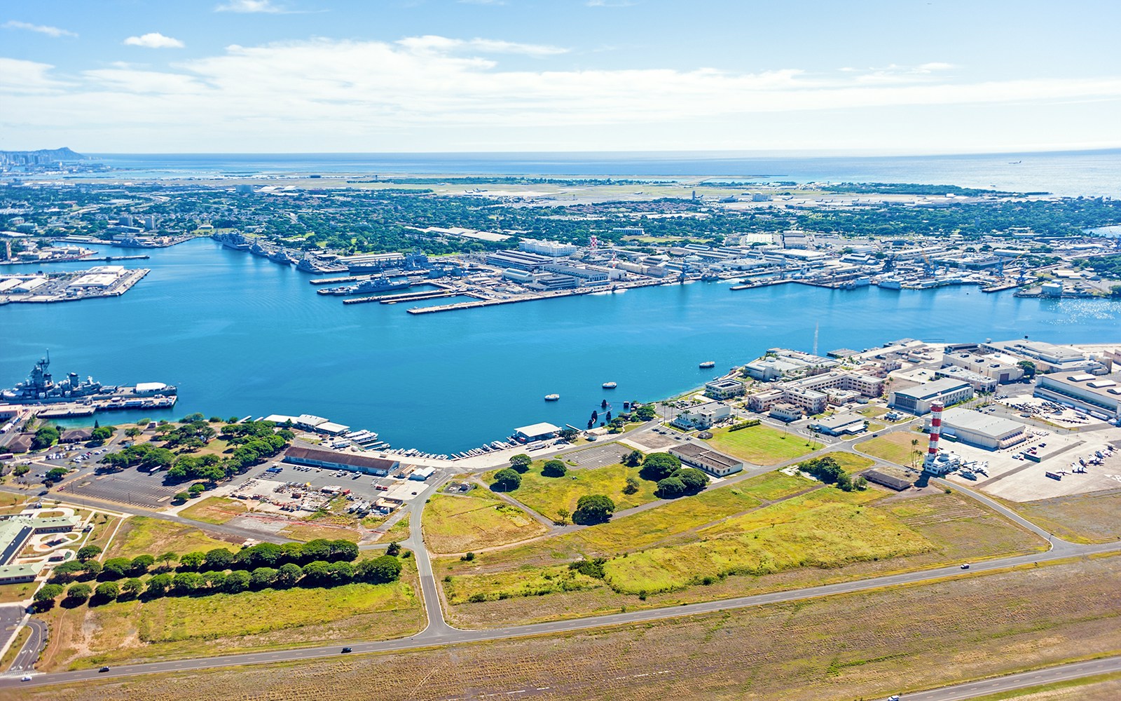 Aerial view of Pearl Harbor, showing naval base and surrounding landscape in Honolulu, Hawaii.