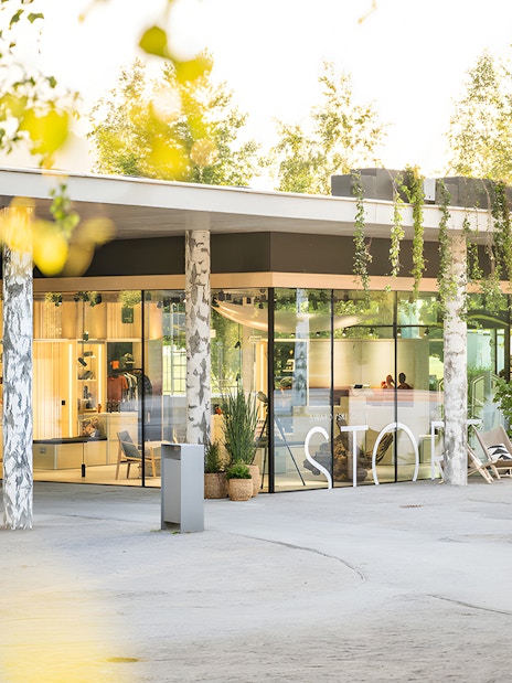 Swarovski Crystal Worlds entrance with modern glass facade and surrounding greenery.