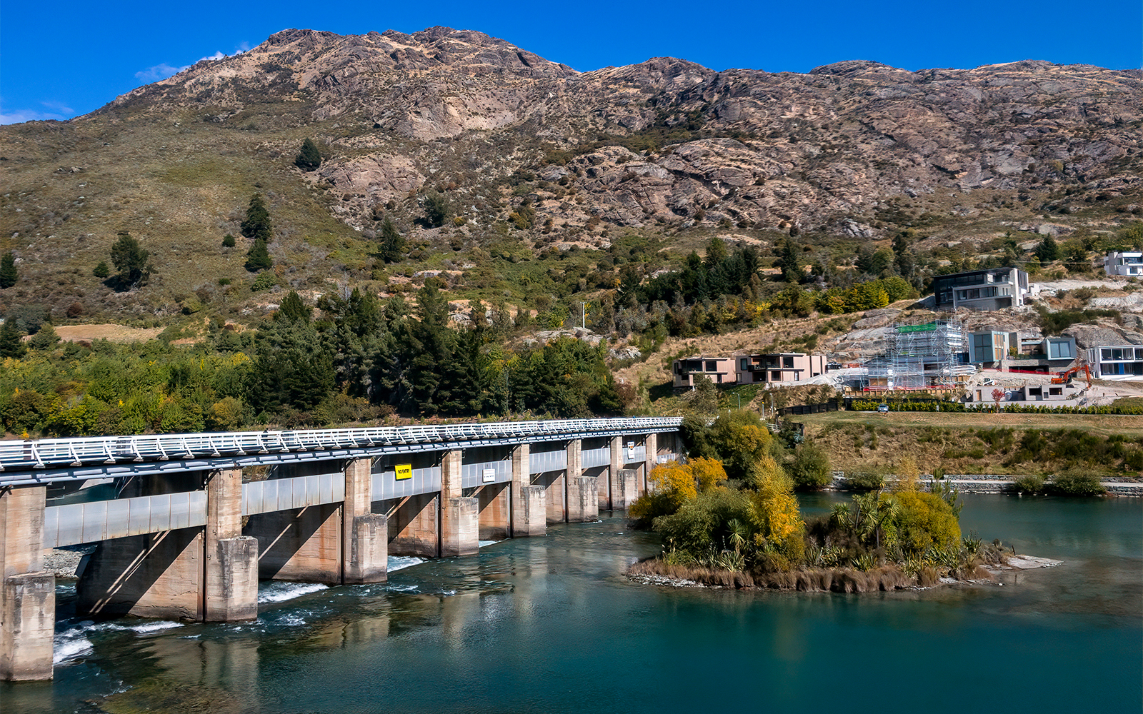 Milford Sound fjord view with cruise ship, surrounded by mountains, Queenstown to Kingston tour.