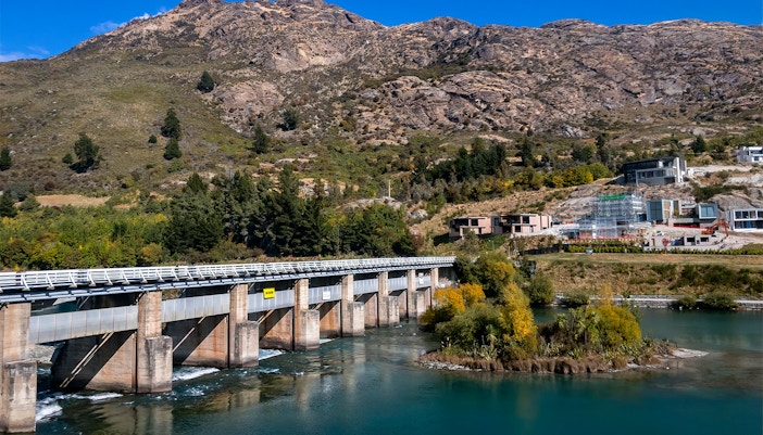 Milford Sound fjord view with cruise ship, surrounded by mountains, Queenstown to Kingston tour.