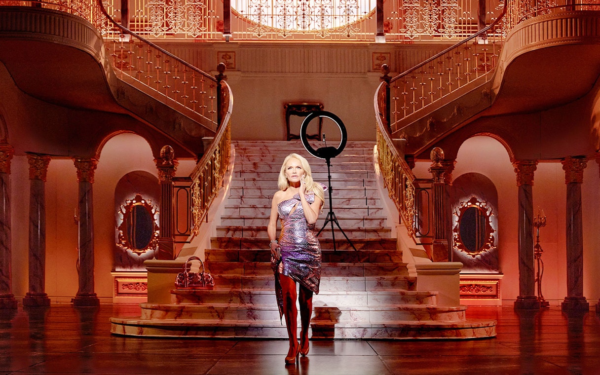 Grand staircase in opulent mansion setting, associated with The Queen of Versailles.