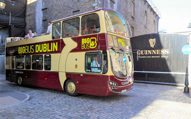 Big Bus tour passing Guinness Storehouse in Dublin.