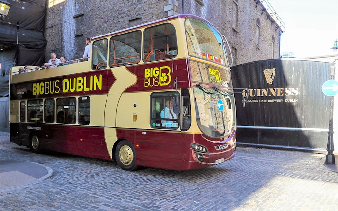 Big Bus tour passing Guinness Storehouse in Dublin.