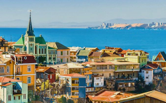 Colorful hillside buildings overlooking the ocean in Valparaíso, Chile.