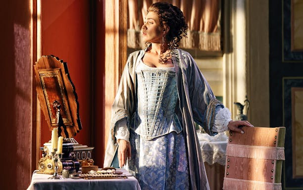 Opera performer in period costume during The Marriage of Figaro scene.