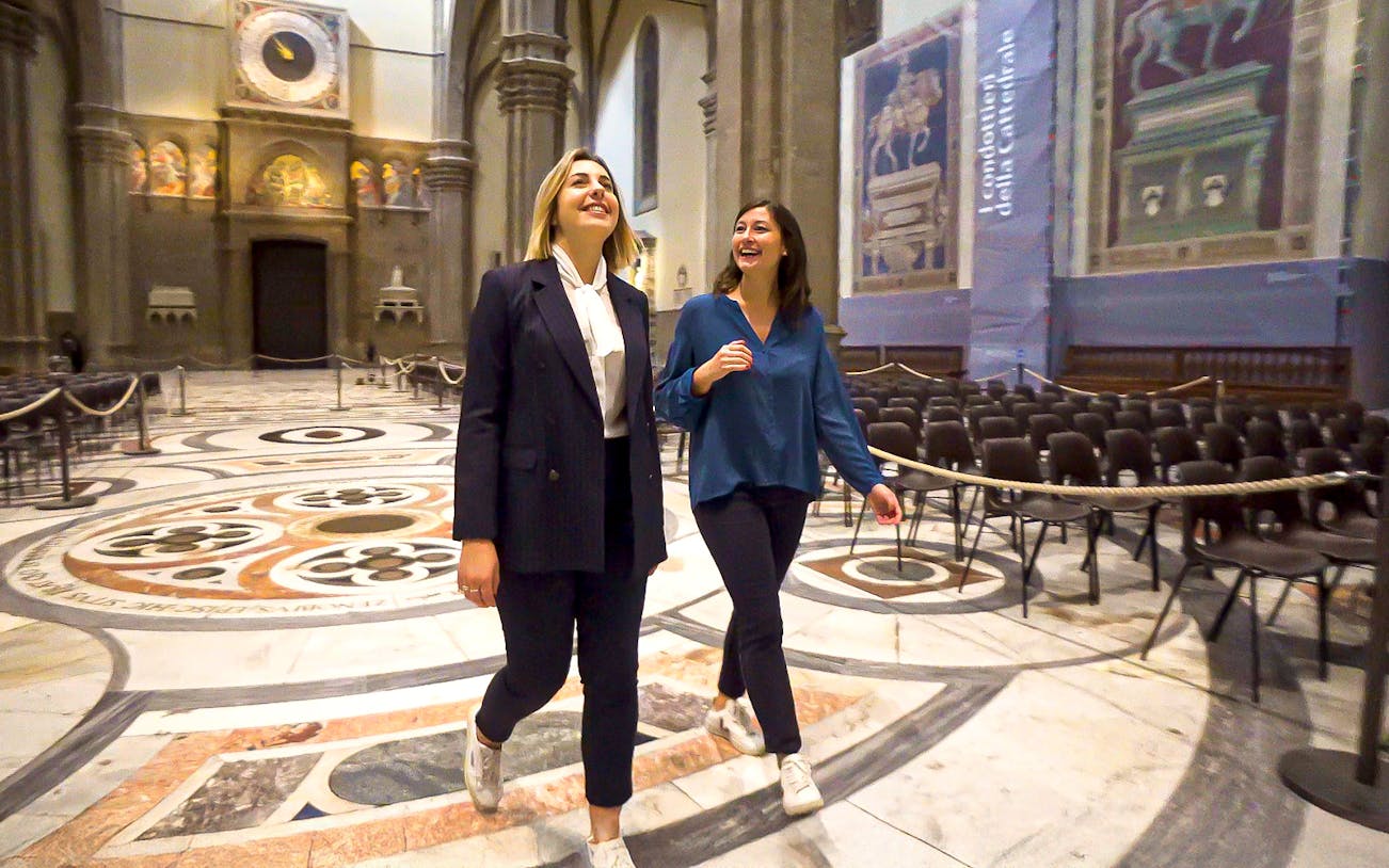 Visitors exploring the interior of Florence's Duomo during a guided tour.
