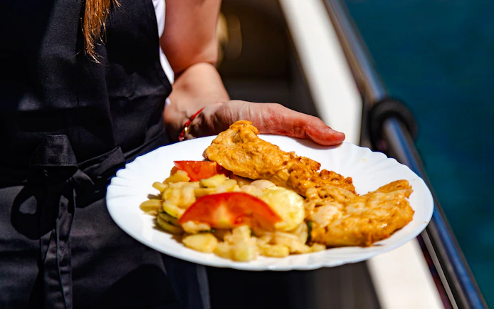 Grilled chicken and vegetables served on a cruise from Dubrovnik to Elaphite Islands.