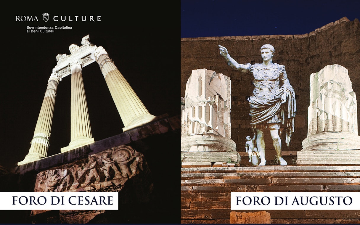 Foro di Cesare and Foro di Augusto illuminated at night in Rome.