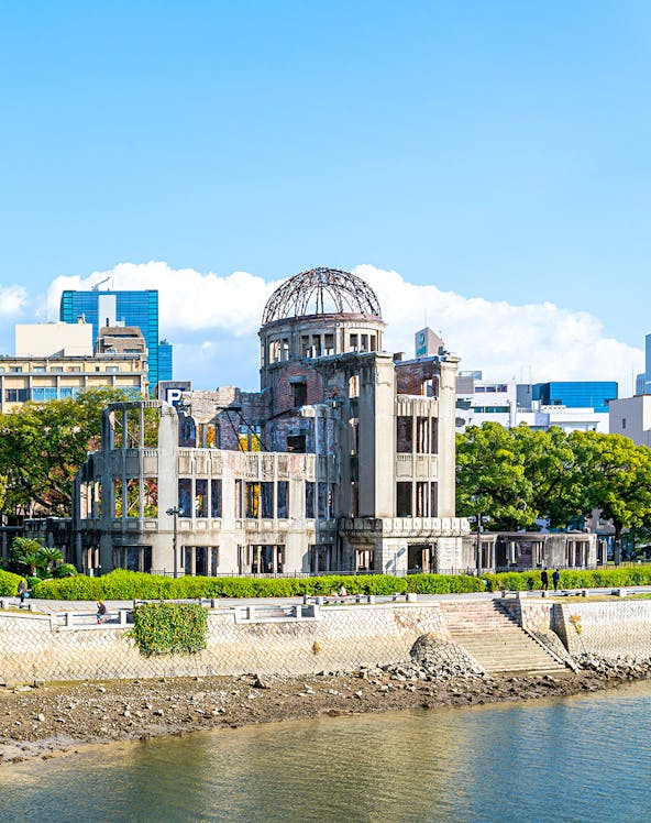 Hiroshima Peace Memorial near Orizuru Tower, Japan, with river and cityscape.