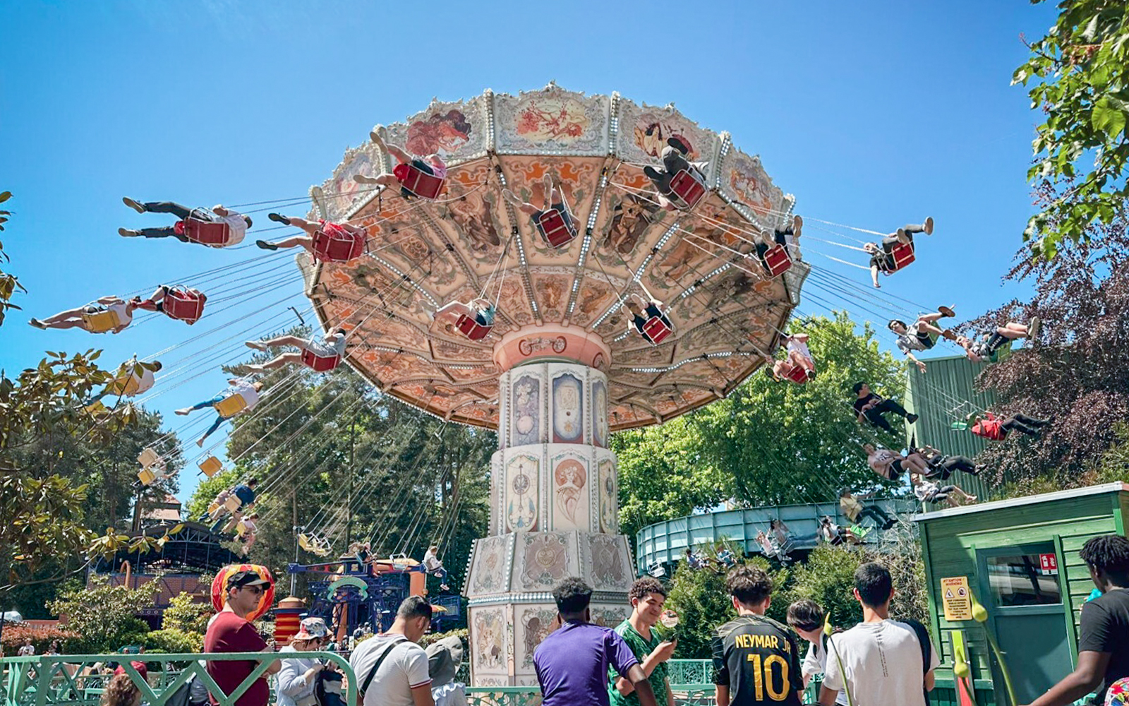 Swing ride at Parc Asterix, France with people enjoying the thrilling experience.