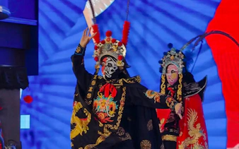 Performers in traditional costumes at a Chongqing face-changing show.