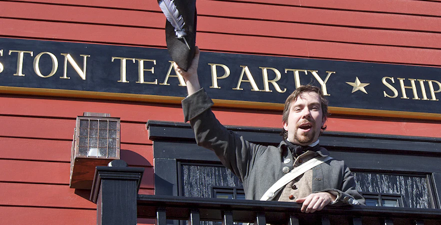 Reenactor in colonial attire at Boston Tea Party Ships & Museum.