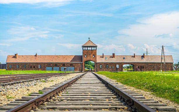 Rail tracks leading to the main gate of Auschwitz-Birkenau, Poland.