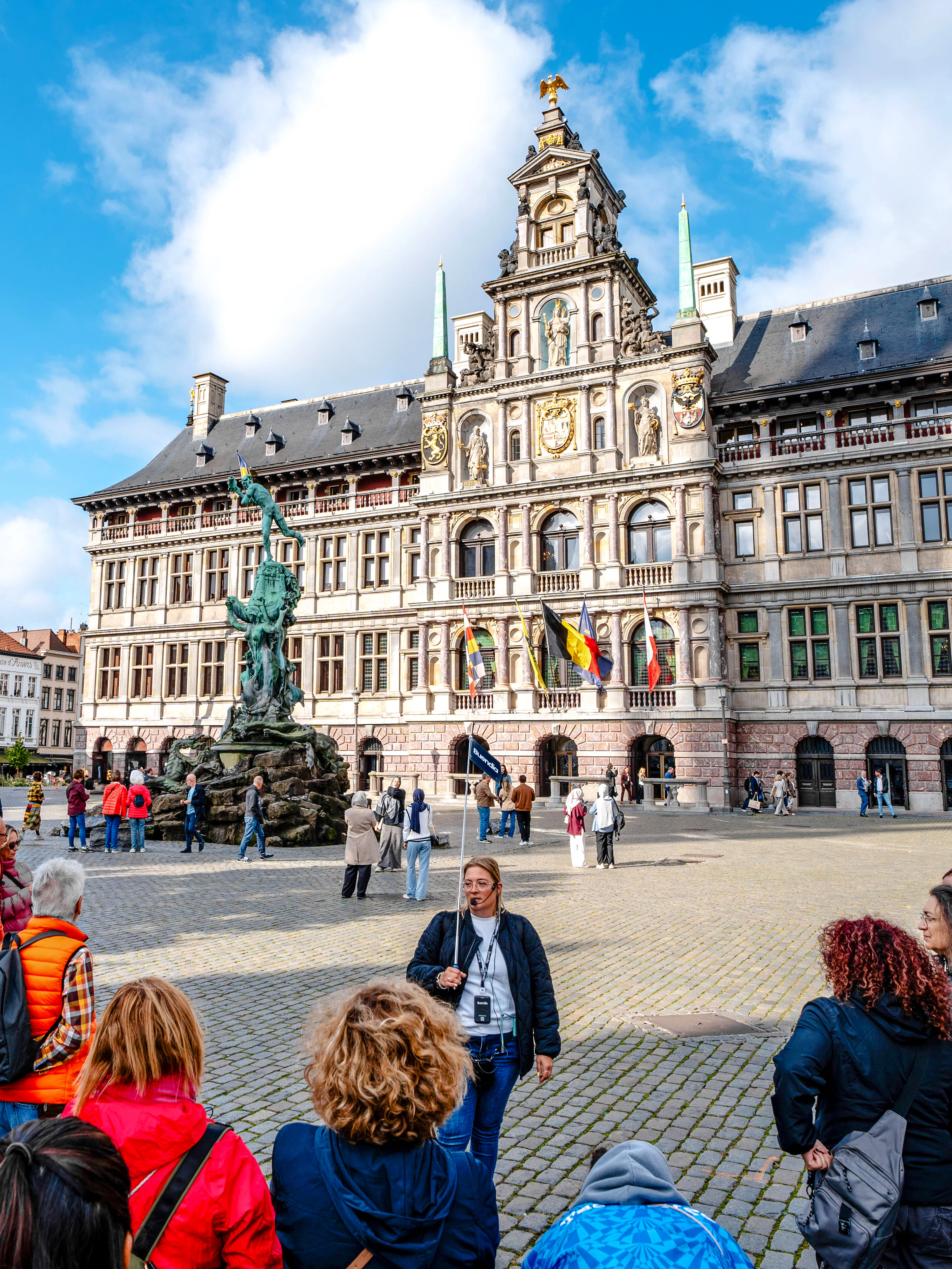 Tour group in front of Antwerp City Hall in Grote Markt, Antwerp, Belgium.