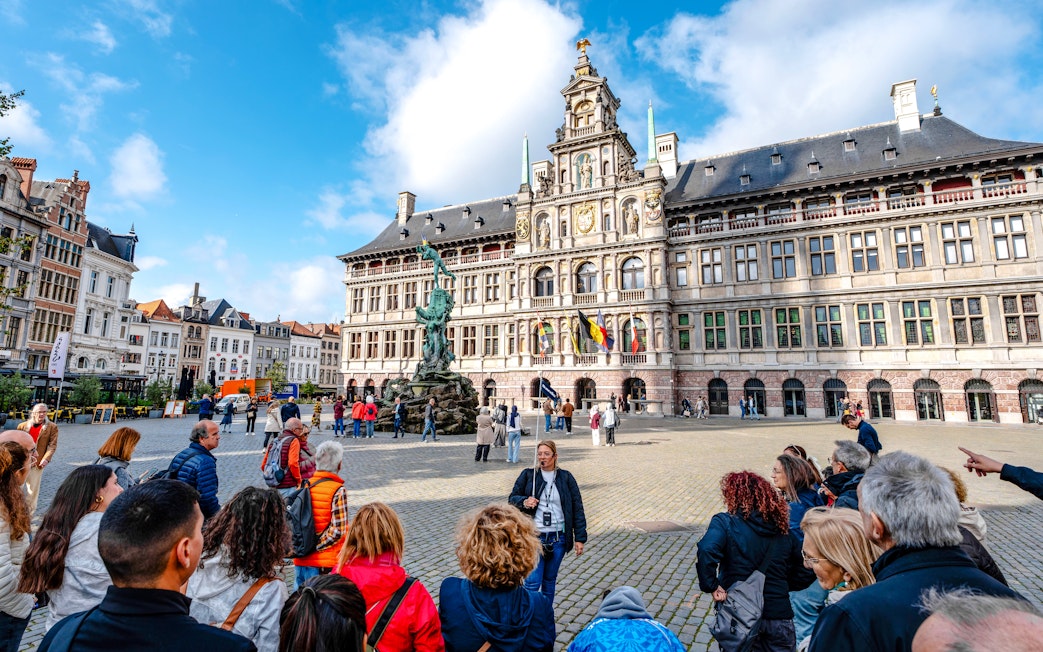Tour group in front of Antwerp City Hall in Grote Markt, Antwerp, Belgium.